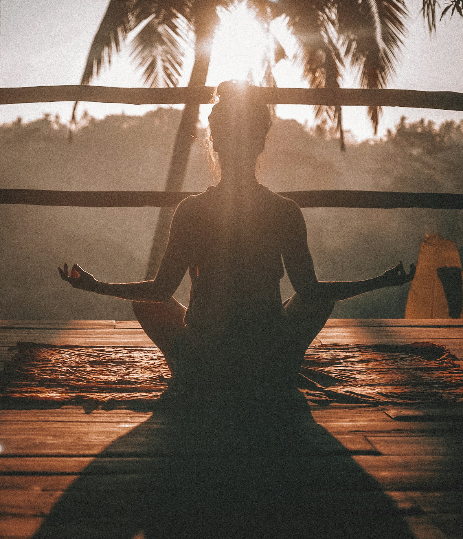 Woman enjoying a quiet seated yoga moment outdoors